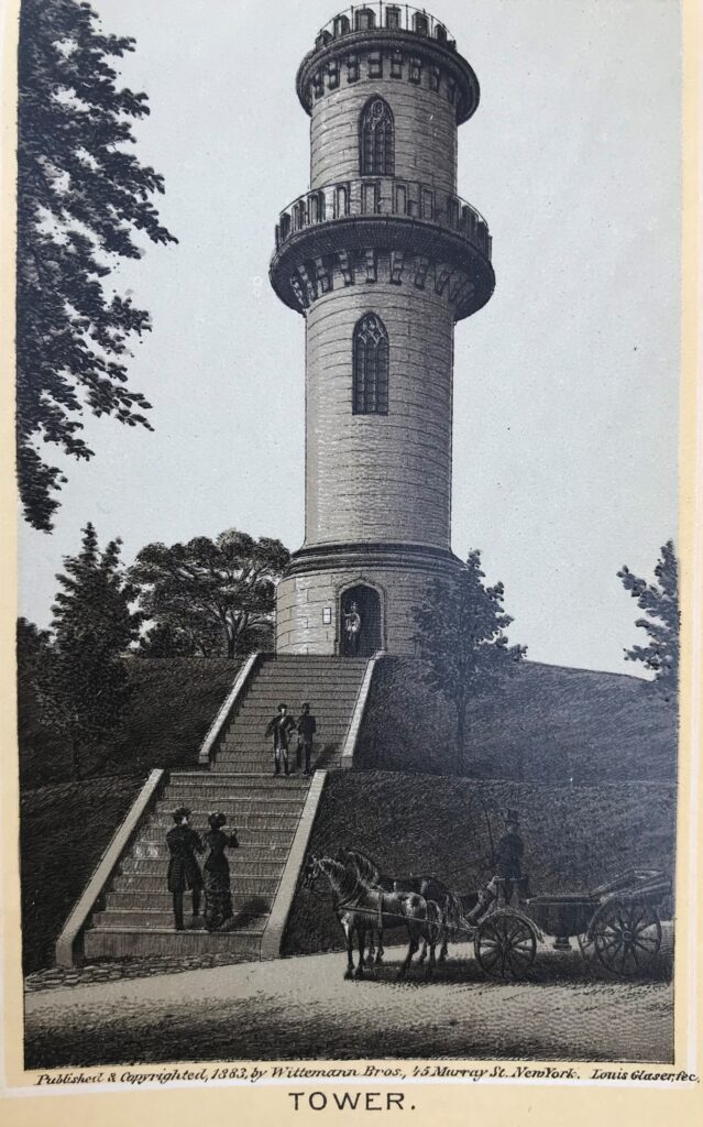 Sepia image of a large stone tower on a hill of grass with people in 19th-century dress climbing stairs to a door at the foot of the tower. In the foreground, is a road and a parked carriage with two horses and driver. Deciduous trees dot the landscape. Publishers’ text is below with title “The Tower.” 